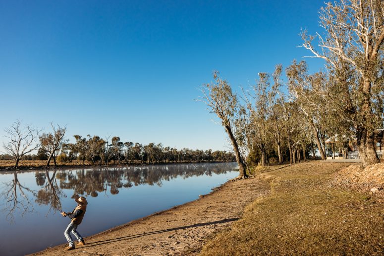 Reeling in a fish at Condamine.